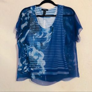 Blue flowy top with stripped tank top underneath